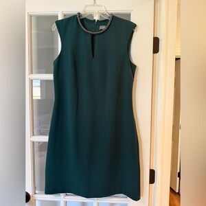 Elegant cocktail dress with neck embellishment